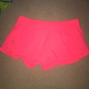 Neon pink athletic shorts